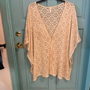 Woman’s plus size lacey coverup. It actually says swim, so I guess it could be.